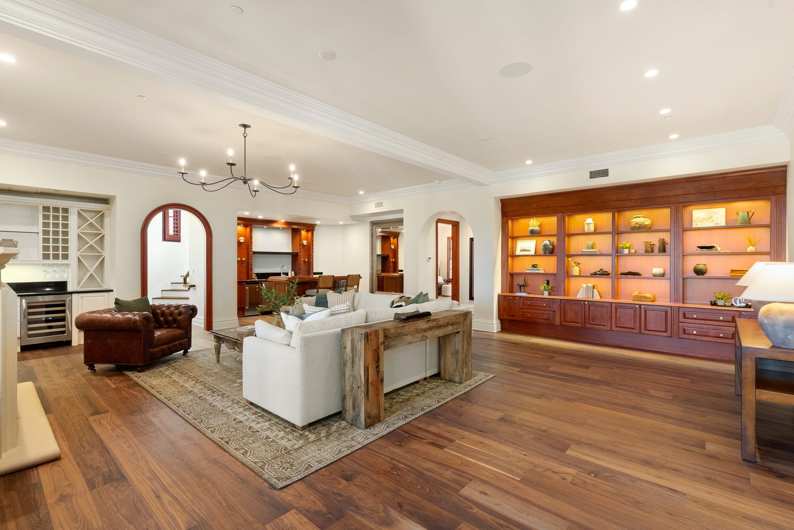 West Villa downstairs living room with fireplace and warm wood floors