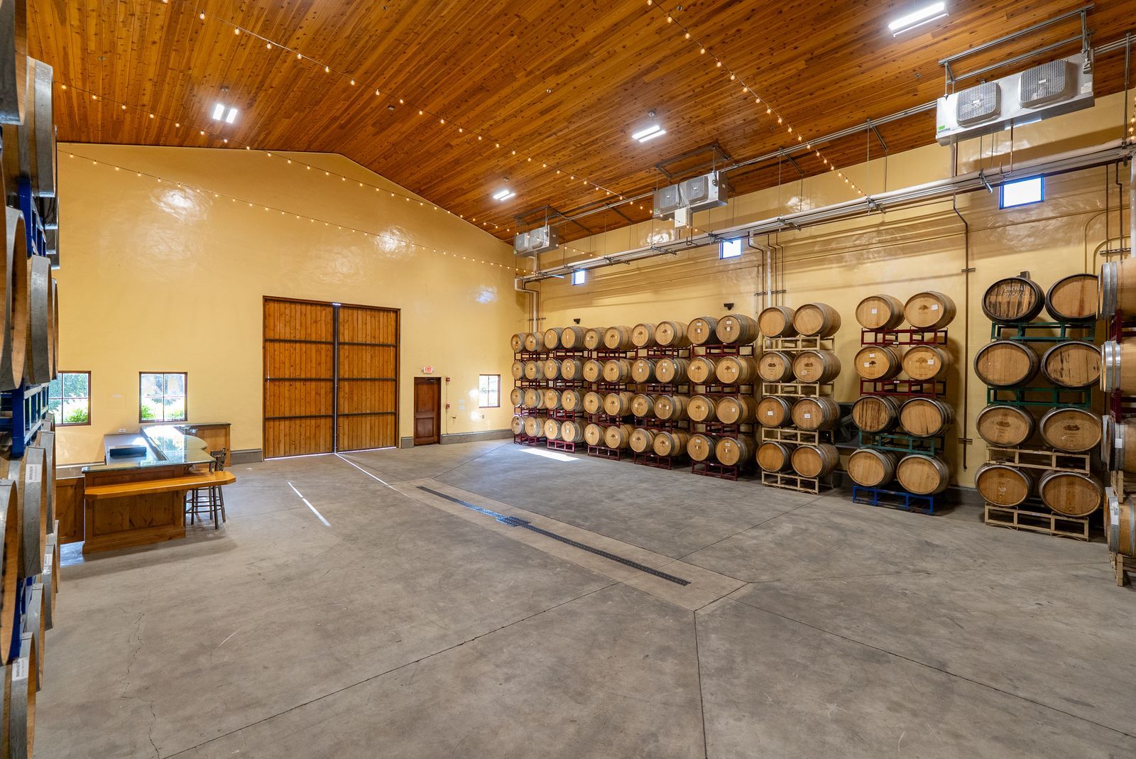 Wide view of wine barrel storage at Villa San-Juliette