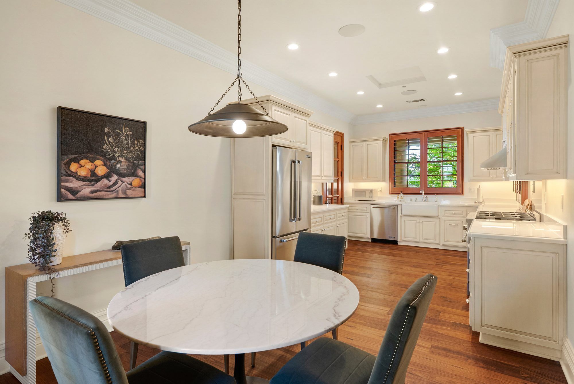 East Villa upstairs kitchen and dining space with warm wood floors