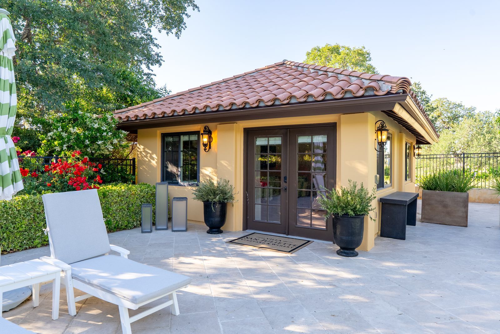 Poolhouse exterior and patio seating