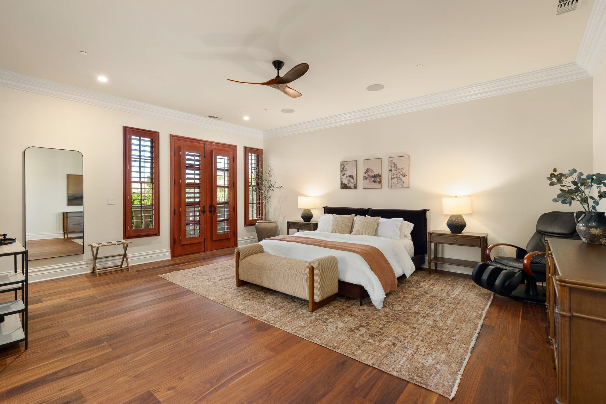 West Villa upstairs bedroom suite with wood floors and vineyard light